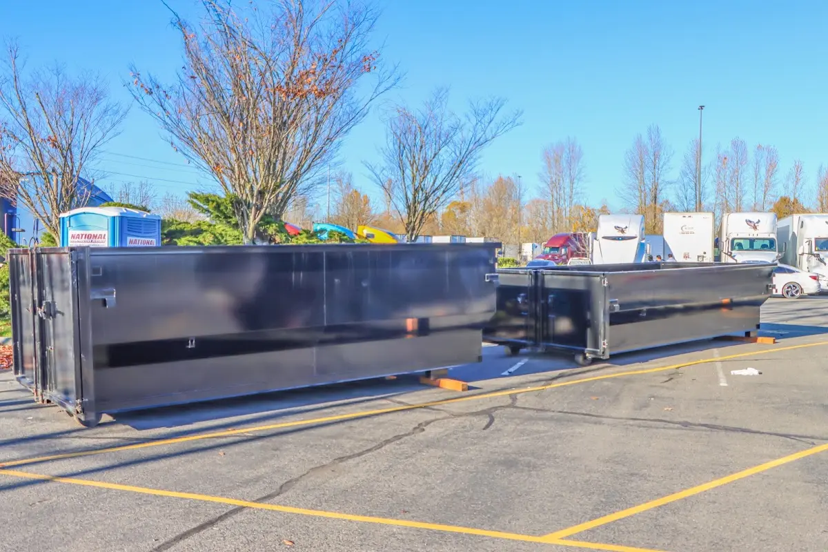 Professional dumpster rental service with roll-off container on residential driveway in Queen Creek